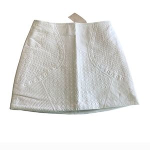 Uniq, NWT Vegan Leather Mini Skirt, Large,  White with Pattern on Front.